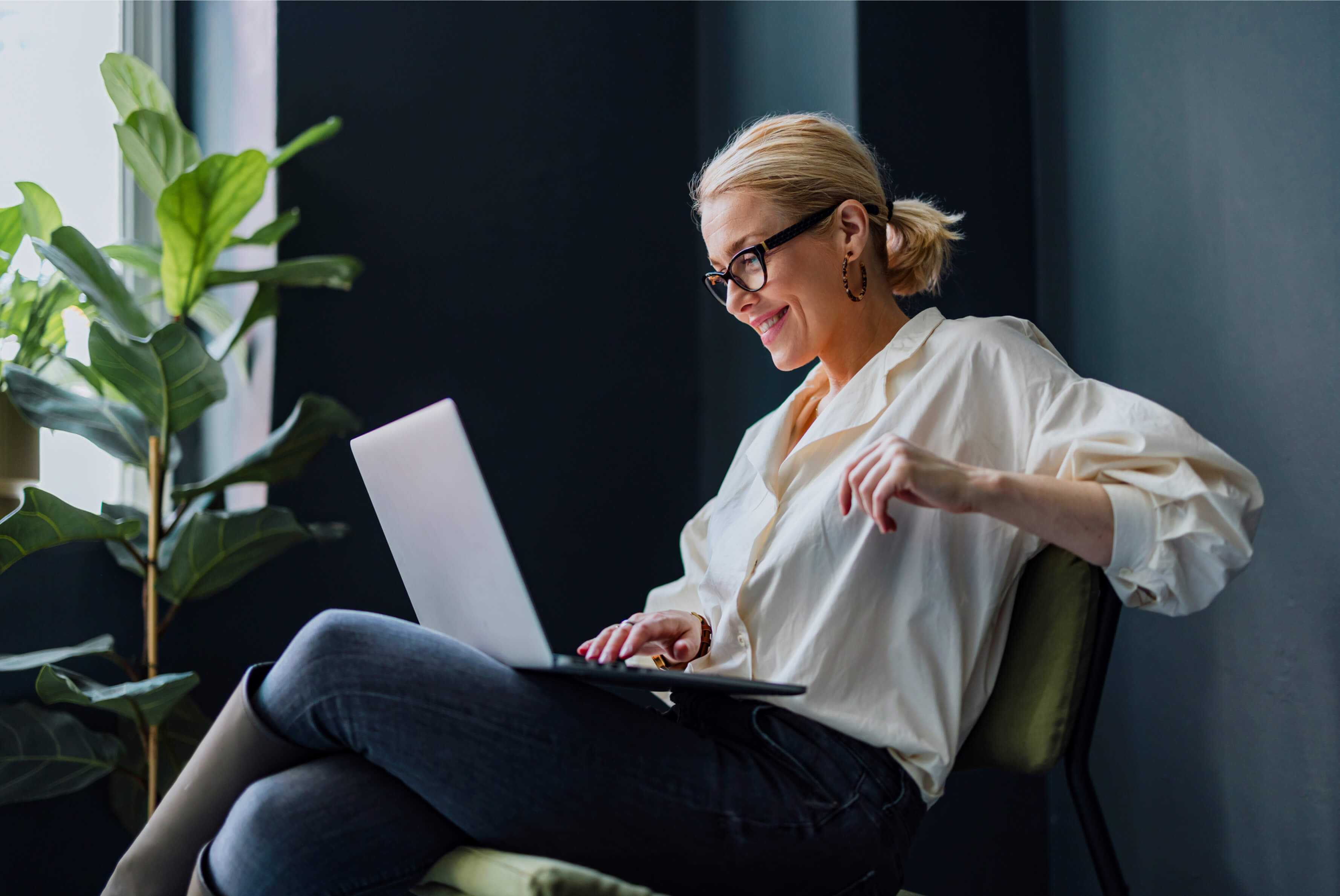 a person looking at it's investment strategies on a laptop